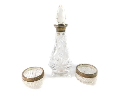 A pair of Edward VII cut glass salts with silver mounts, London 1904, together with a cut glass scent bottle with silver moun