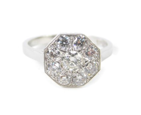 A platinum and diamond nine stone daisy head ring, in an octagonal setting, approx 1ct, size N, 4.5g.