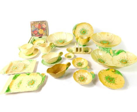 A group of Carltonware pottery decorated in the yellow Buttercup pattern, including dishes, sauce boats and stands, tea cup a
