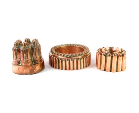 Three Victorian copper mousse or jelly moulds, one of Castle form by F L Paulmann, Hanover., 13cm H, and two ring moulds, 19.