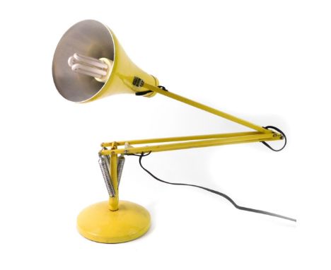 A late 20thC Herbert Terry &amp; Sons Ltd yellow angle poised table lamp.