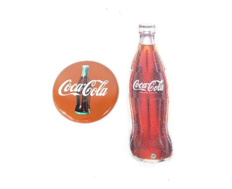 An enamel circular Coca Cola advertising sign, The Coca Cola Company 1990, 27cm Dia, together with a Coca Cola bottle, 92cm H