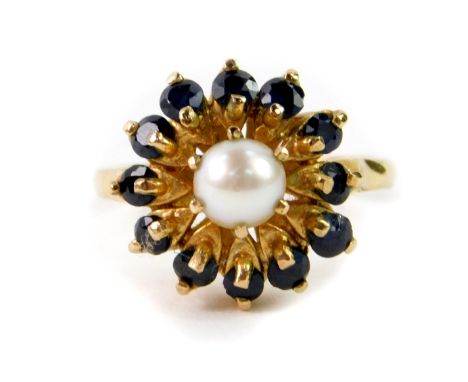 A 9ct gold cultured pearl and sapphire set flower head ring, high claw set, size M, 4.6g.