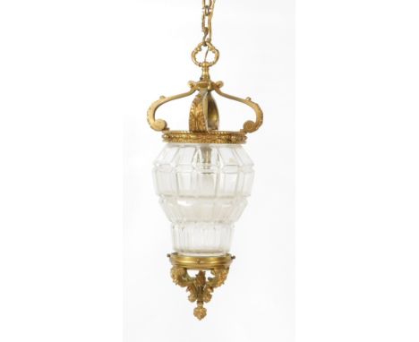 A Victorian style brass and cut glass ceiling lantern, with leaf cast scrolling arms, and honeycomb glass shade, with chains,