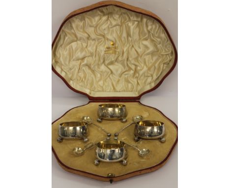 A set of four Mappin &amp; Webb circular silver salts with matching spoons, Sheffield 1903, 213g, cased.