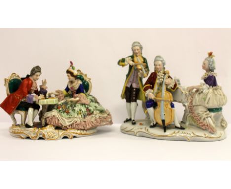 A Continental porcelain figure group of a couple playing chess, 18cm; Continental porcelain figure group of a trio of musicia