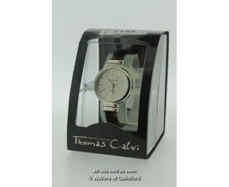 Ladies' Thomas Calvi wristwatch, circular silvered dial with baton hour markers, on a plastic tortoiseshell design bangle, bo