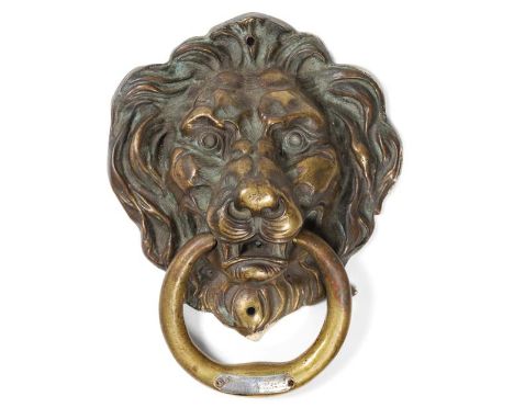 A Late 18th Century Brass Lion Mask and Ring Door Knocker,  the ring set with a later silver coloured metal plaque engraved w