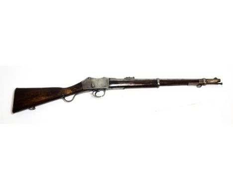 A Victorian Martini Henry I.C.1 Artillery Carbine, the 52.5cm steel barrel with hinged ladder rear sight, numerous inspector'