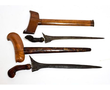 A Javanese Kris, with 34cm straight pamor blade, the beaded mendak set with ruby and diamond type stones, the wood pistol gri