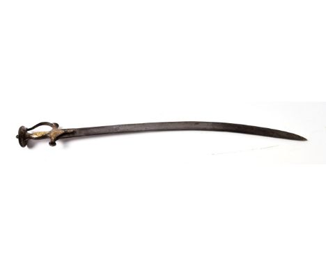 An 18th Century Indian Talwar, the 77cm single edge curved steel blade double edged for the last 27cm, the steel hilt with ko