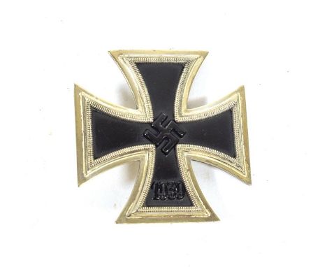 A German Third Reich Iron Cross, first class, with vertical sword shape pin