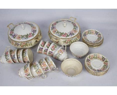 A collection of Paragon dinner and tea wares in the Country Lane pattern including tureens, cups, saucers and similar, approx