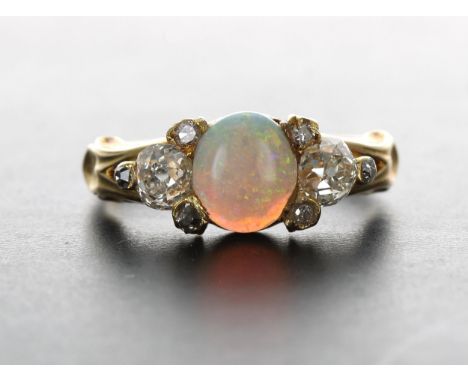 Attractive 18ct cabouchon opal and old-cut diamond claw set ring, the opal 0.55ct approx, width 7mm,&nbsp;3.5gm, ring size J/