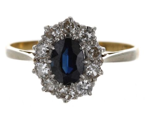 18ct yellow gold oval sapphire and diamond cluster ring, the sapphire 0.75ct approx, in a border of ten round brilliant-cut d