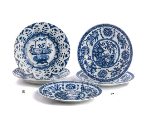 A SET OF THREE CHINESE BLUE AND WHITE PLATES, KANGXI PERIOD (1662-1722)each painted with a panel of a boy on a balcony before