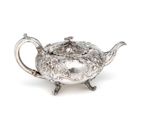 ˜A VICTORIAN SILVER TEAPOT, J.C. EDINGTON, LONDON, 1844 compressed circular, engraved with a coat of arms and with a crest an