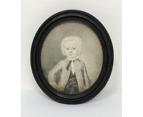 A PORTRAIT DRAWING OF A YOUNG BOY, ENGLISH SCHOOL, CIRCA 1740 half length, graphite on paper, turned wood frame 9.7cm oval   