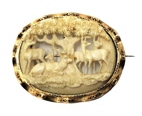 ˜Ⓖ A GOLD BROOCH MOUNTED IVORY PANEL, GERMAN, PROBABLY ERBACH, MID 19TH CENTURY the oval panel finely openwork carved as a re