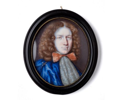 A PORTRAIT MINIATURE OF A GENTLEMAN, ENGLISH SCHOOL, CIRCA 1665  with brown hair, wearing a blue cloak and lace cravat tied w