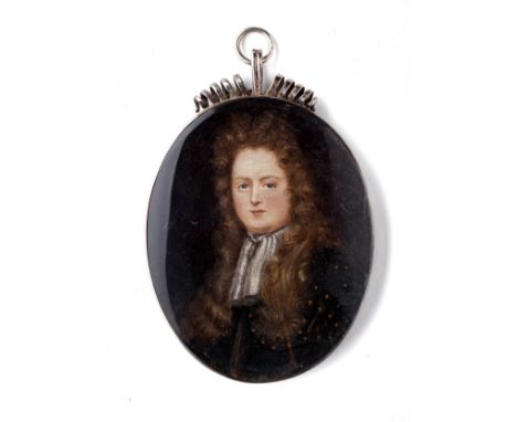 A PORTRAIT MINIATURE OF A GENTLEMAN, ENGLISH SCHOOL, CIRCA 1690 with long curling hair, wearing armour and a lace cravat, mix