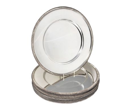 Ⓖ&nbsp;A SET OF TWELVE ELECTROPLATE DINNER PLATES, 20TH CENTURY dished circular, plain excepting gadroon rims 30cm diameter P