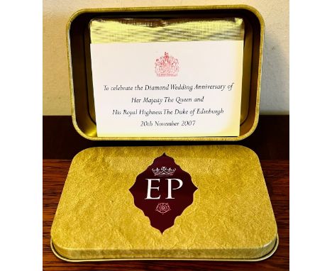 A PIECE OF FOIL WRAPPED, UNOPENED CAKE TO CELEBRATE THE DIAMOND WEDDING ANNIVERSARY OF HER LATE MAJESTY QUEEN ELIZABETH II AN