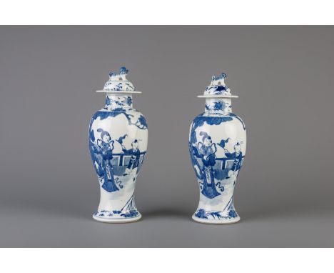 Title: A pair of Chinese blue and white vases and covers with figures in a garden, Kangxi mark, 19th C. Description: Dimensio