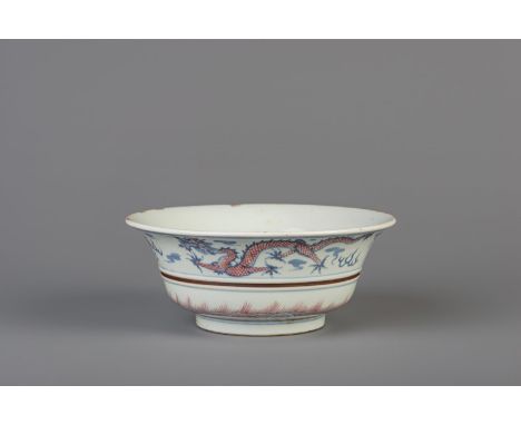 Title: A Chinese blue, white and copper red 'dragon and phoenix' bowl, Kangxi mark, 19th/20th C. Description: Dimensions:  H 