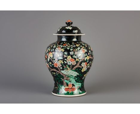 Title: A Chinese famille noire 'magpie and prunus' vase and cover, Kangxi mark, 19th C. Description: Dimensions:  H 40,5 cm  