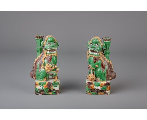 Title: A pair of sancai glazed biscuit Buddhist lion joss-stick holders, Kangxi Description: Dimensions:  H 20,5 cm