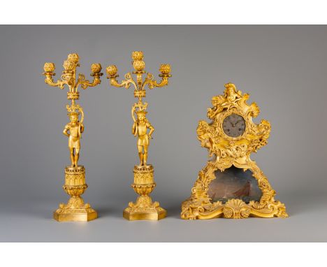 A gilt metal Poseidon mantel clock and a pair of Gothic revival candelabras, probably France, 19th/20th C.Dimensions:H 45 cm 