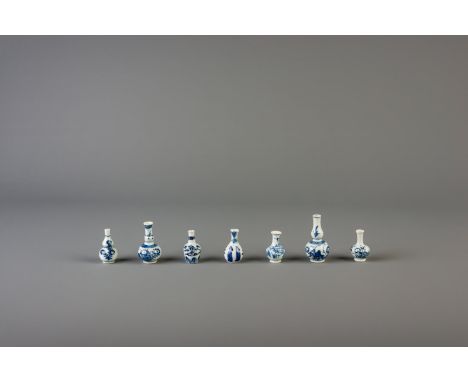 Title: Seven Chinese blue and white doll's house miniature double gourd and bottle vases, Kangxi Description: Dimensions:  H 