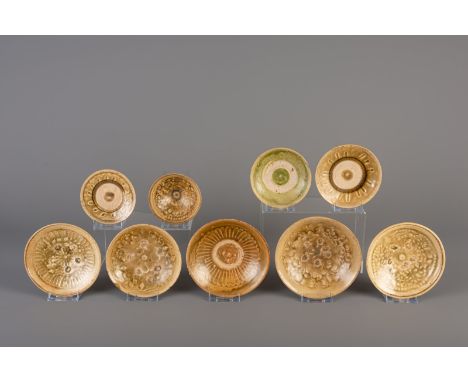 Title: Nine Vietnamese green glazed saucers and bowls with underglaze design, Thanh Hoa, 9th/10th C. Description: Dimensions: