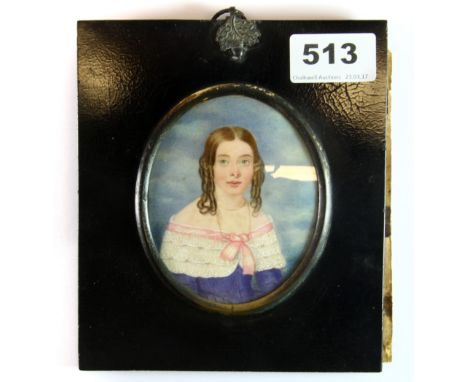 A mid 19th century watercolour on ivory miniature portrait of a young girl, in a black lacquered frame, frame size 16cm x 13.