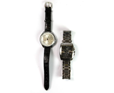 An unsual stainless steel Timex watch and a Russian wristwatch.