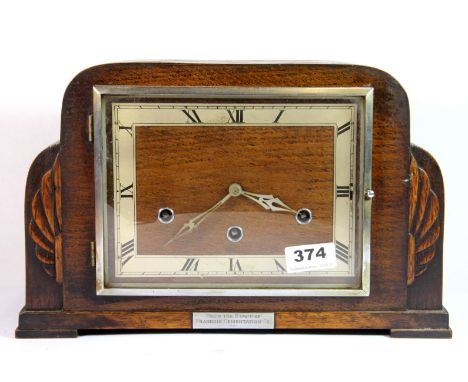 An Art Deco chiming oak mantle clock, W. 33cm.