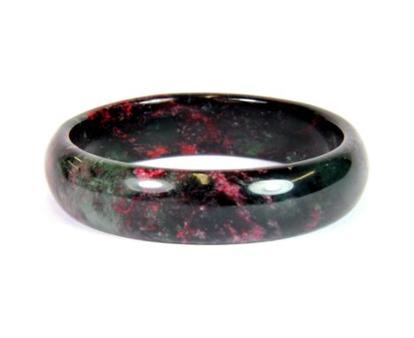 An unusal Chinese mixed colour jade bangle, internal diameter 5.7cm.