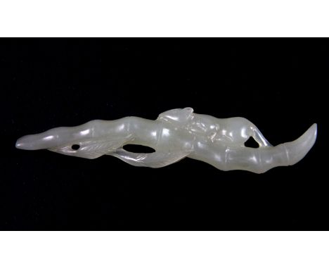 A 19th century Chinese carved celadon jade amulet of a squirrel on a stem of bamboo, L. 9.5cm.