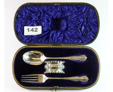 A late Victorian hallmarked silver matched Christening set comprising of a spoon, fork and a napkin ring, in velvet lined fit