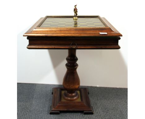 A cold painted Napoleonic design brass chess set and table with additional backgammon and draughts.