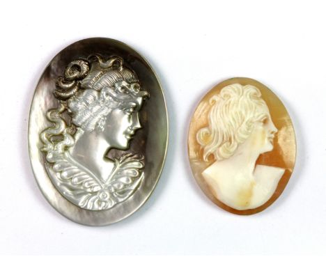 An un-mounted carved mother of pearl cameo together with a further pate de verre cameo.