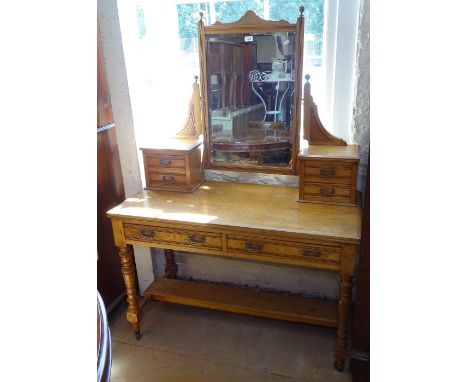 An Arts and Crafts ash dressing table, with bevelled swing mirror, with 2 frieze drawers, raised on ring turned legs, W115cm 