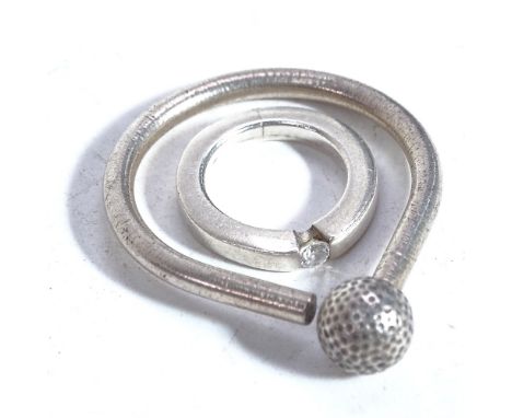 A Georg Jensen silver golfing keyring, and a stylised silver stone set ring (2) 