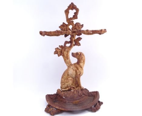 A Victorian painted cast-iron umbrella/stick stand, seated dog and floral decoration, overall height 70cm 