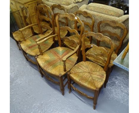 A set of 8 French oak ladder-back and rush-seated dining chairs (6 and 2) 