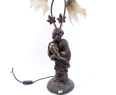 An Art Nouveau style resin embracing couple table lamp, overall height 66cm 