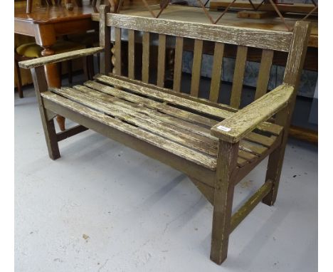 A stained teak slatted garden bench 