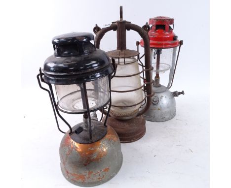 A German pre-ww2 oil lantern, marked FEURHAND H201, and 2 other Vintage metal portable oil lanterns, largest height 40cm (3)