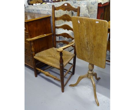 A Victorian oak ladder-back rush-seated elbow chair, and an oak rectangular top tripod table 